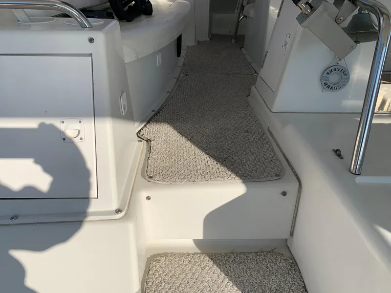 Slide: The Image of 1992 Silverton 34 Aft Cabin Motor Yacht interior steps with carpeted flooring. - 23