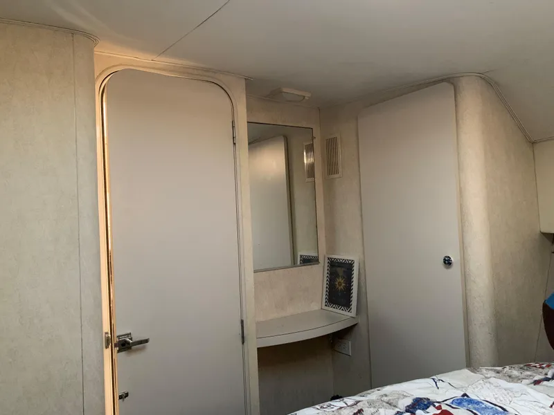 Slide: The Image of Interior of 1992 Silverton 34 Aft Cabin Motor Yacht with mirror and door. - 29