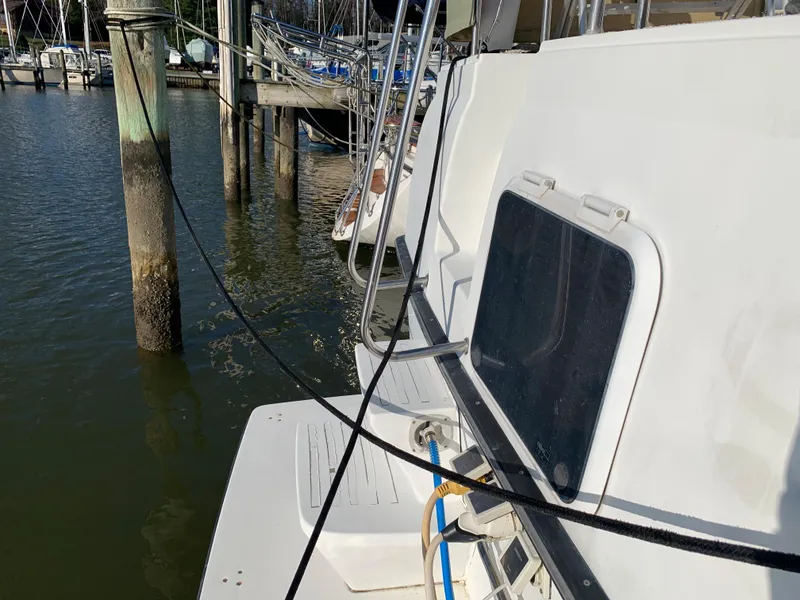 Slide: The Image of 1992 Silverton 34 Aft Cabin Motor Yacht docked at marina, side view. - 3