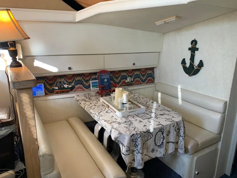 Slide: The Image of Interior of 1992 Silverton 34 Aft Cabin Motor Yacht with cozy dining area. - 33