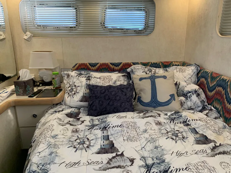 Slide: The Image of Cozy bedroom in 1992 Silverton 34 Aft Cabin Motor Yacht with nautical-themed bedding. - 41