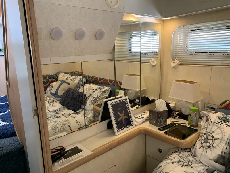 Slide: The Image of Interior of 1992 Silverton 34 Aft Cabin Motor Yacht with cozy bedroom and nautical decor. - 47
