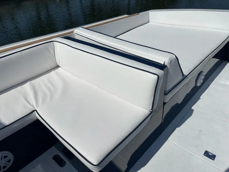 Slide: The Image of 1984 Magnum Marine boat with white cushioned seating. - 10