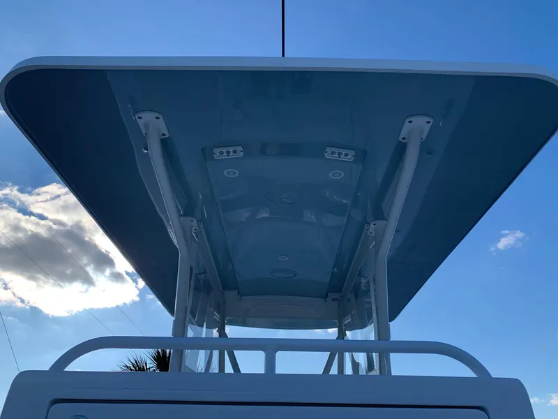 Slide: The Image of 2024 Invincible 33 Open Fisherman boat with T-top against blue sky. - 17