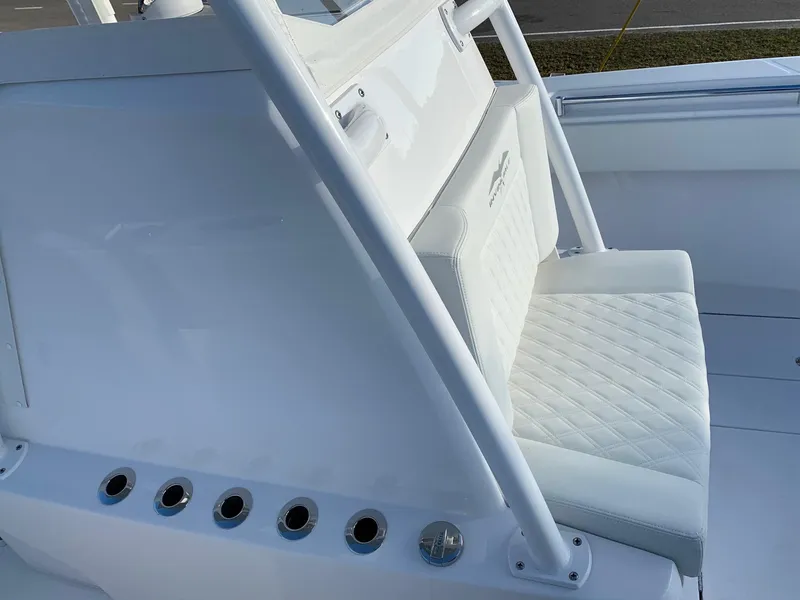 Slide: The Image of 2024 Invincible 33 Open Fisherman boat seating and console detail. - 26