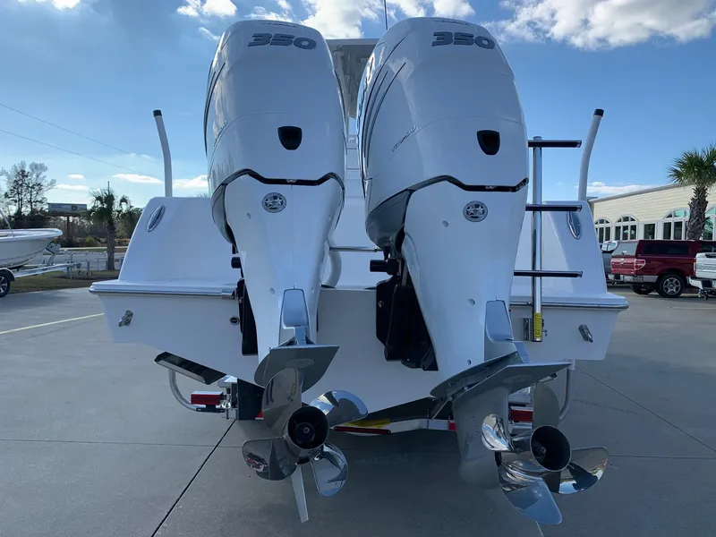 Slide: The Image of 2024 Invincible 33 Open Fisherman with twin 350 engines, rear view. - 3