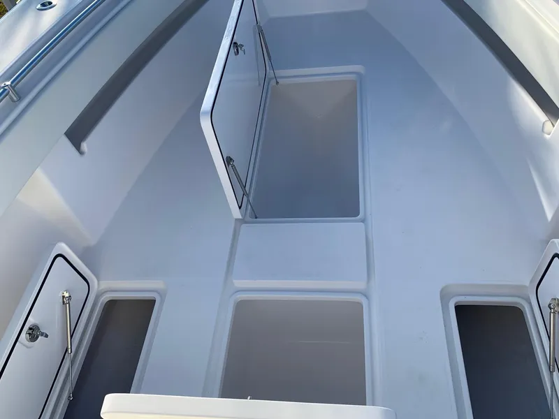 Slide: The Image of 2024 Invincible 33 Open Fisherman boat storage compartments. - 30