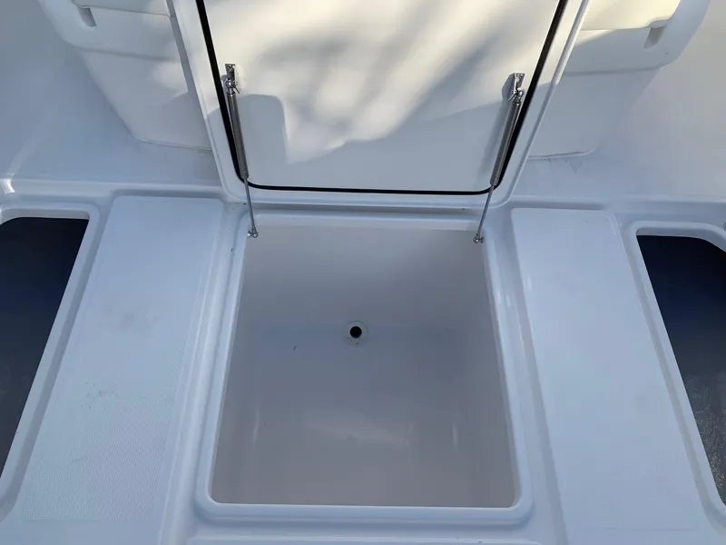 Slide: The Image of 2024 Invincible 33 Open Fisherman storage compartment. - 32