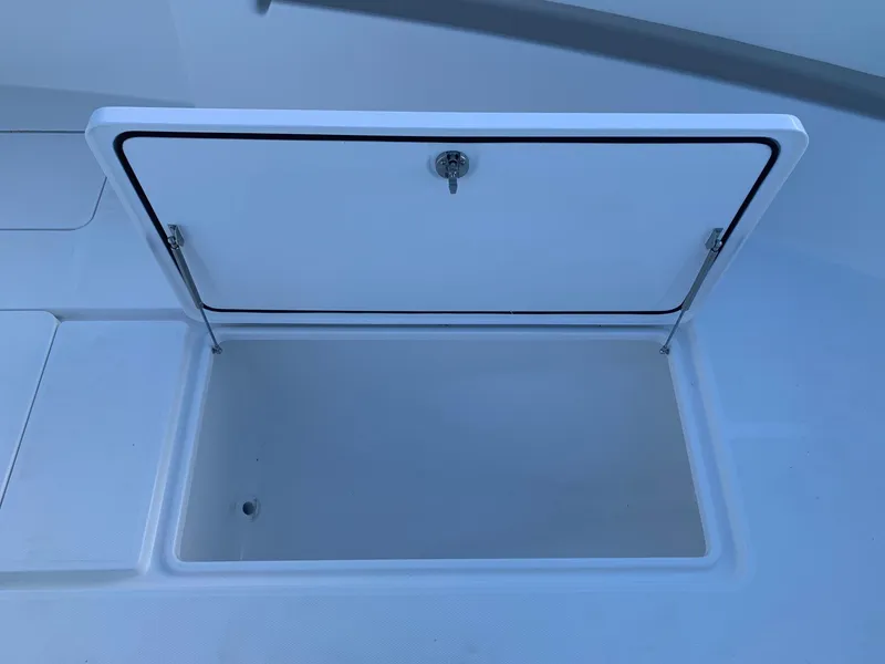 Slide: The Image of Open storage compartment on 2024 Invincible 33 Open Fisherman boat. - 33