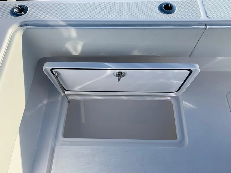 Slide: The Image of 2024 Invincible 33 Open Fisherman storage compartment. - 10