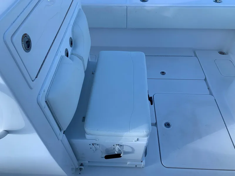 Slide: The Image of 2024 Invincible 33 Open Fisherman boat interior seating and storage. - 14