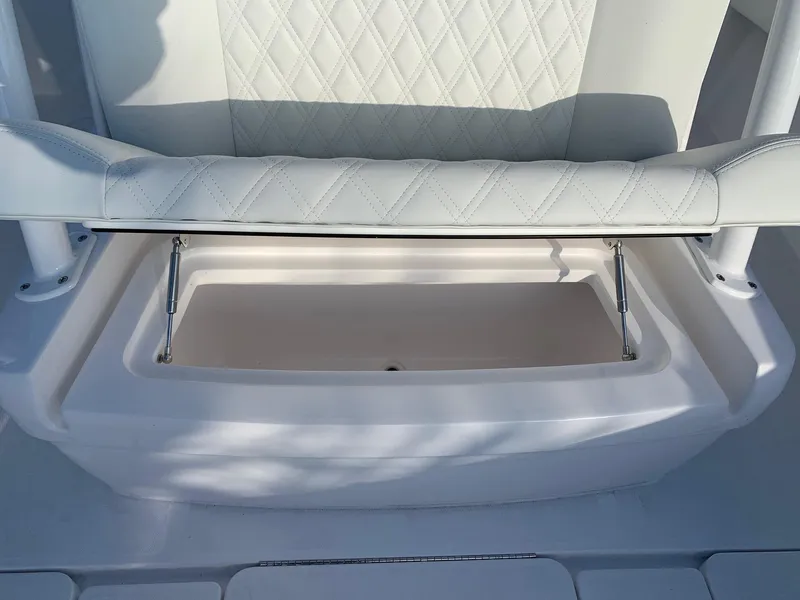 Slide: The Image of 2024 Invincible 33 Open Fisherman boat seat with storage compartment. - 29