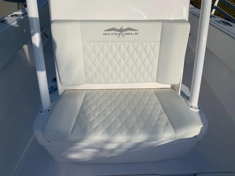 Slide: The Image of 2024 Invincible 33 Open Fisherman white cushioned seat with logo. - 30