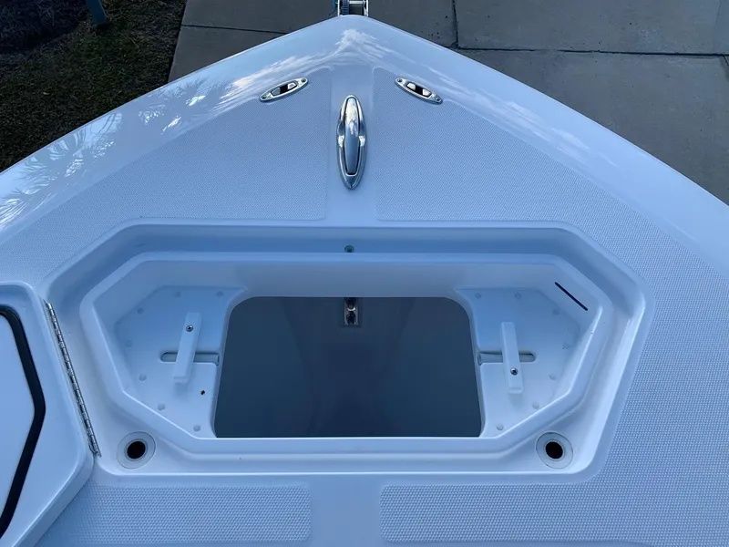 Slide: The Image of 2024 Invincible 33 Open Fisherman bow storage compartment. - 35