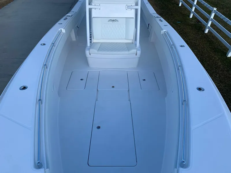 Slide: The Image of 2024 Invincible 33 Open Fisherman boat deck with seating and storage compartments. - 37