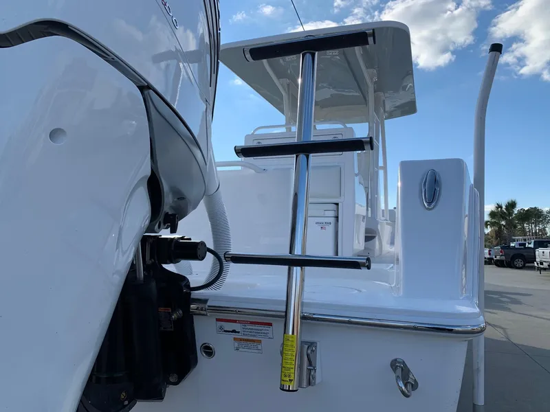 Slide: The Image of 2024 Invincible 33 Open Fisherman boat with ladder and outboard motor. - 39