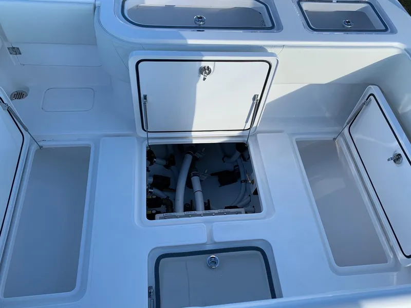 Slide: The Image of 2024 Invincible 33 Open Fisherman boat storage compartments and access hatches. - 9