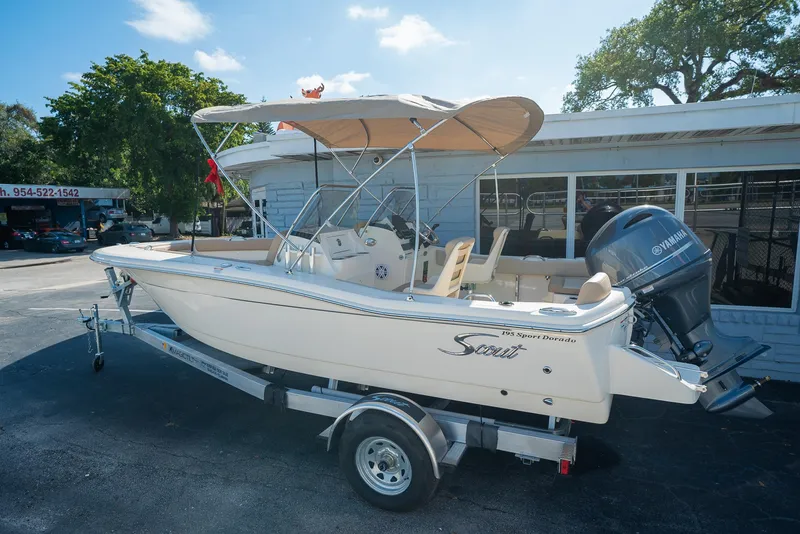The Image of 2026 Scout 195 Sport Dorado boat on trailer, Yamaha engine. - 0