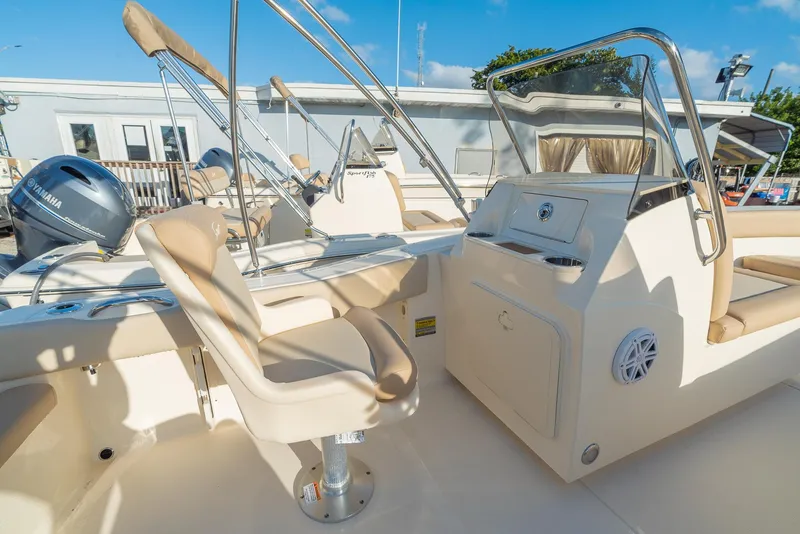 Slide: The Image of Interior of 2026 Scout 195 Sport Dorado with beige seating. - 12