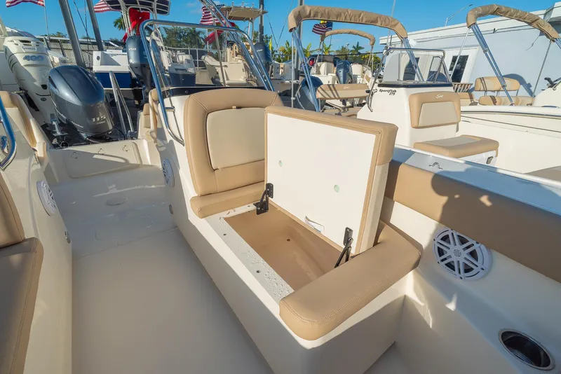 Slide: The Image of Scout 2026 Sport Dorado boat with open seat storage. - 14