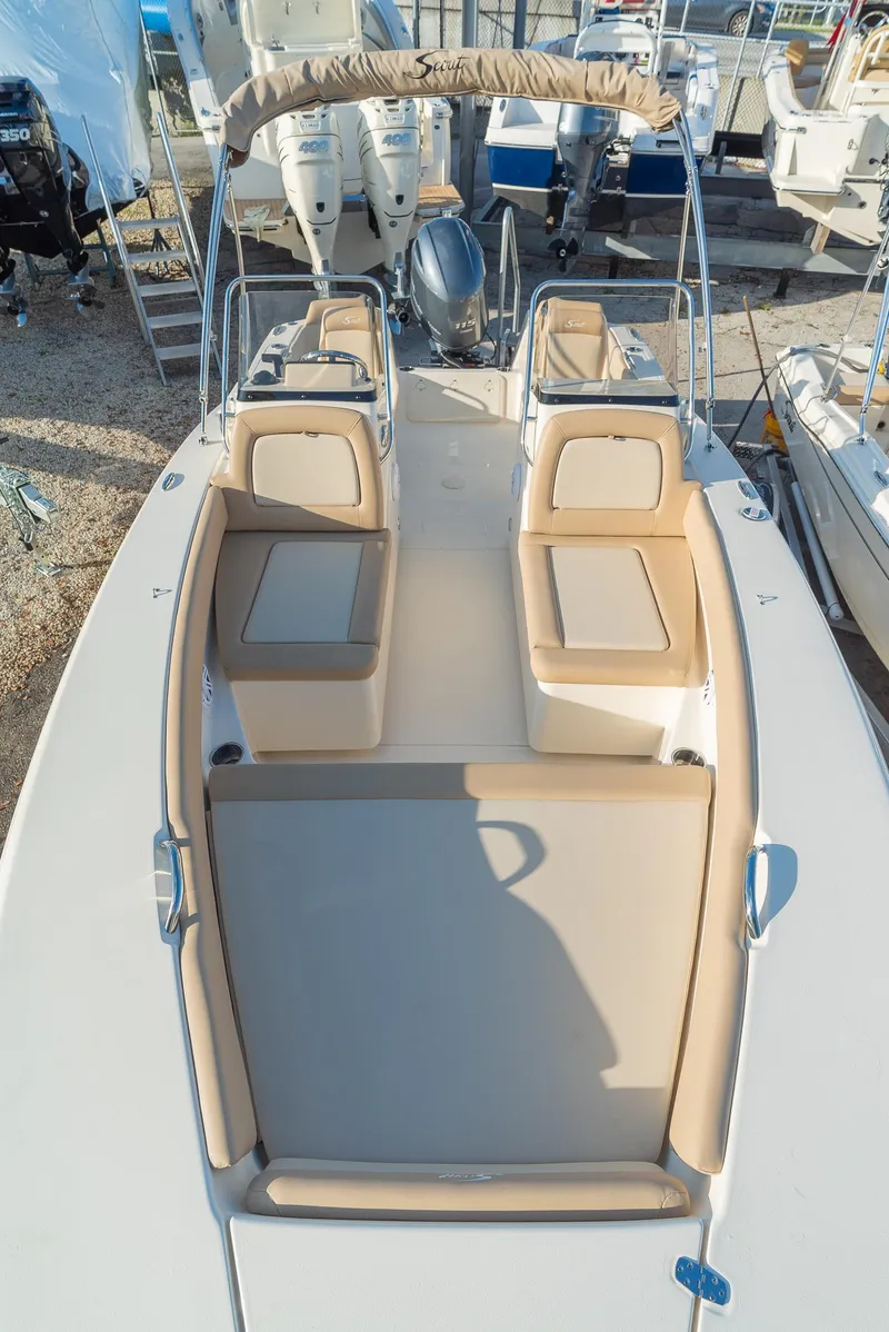 Slide: The Image of Scout 195 Sport Dorado 2026 with beige seating and sunshade. - 16