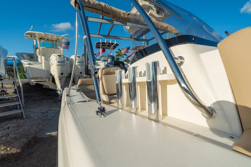 Slide: The Image of Scout 195 Sport Dorado 2026 boat with stainless steel details in harbor. - 22