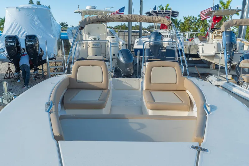 Slide: The Image of Scout 195 Sport Dorado 2026 with beige seating at the marina. - 3