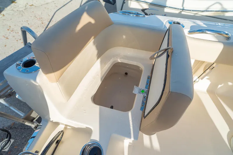 Slide: The Image of Scout 195 Sport Dorado 2026 seating area with storage compartment. - 8