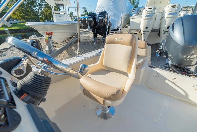 Slide: The Image of Interior of 2026 Scout 195 Sport Dorado with steering and seat. - 9