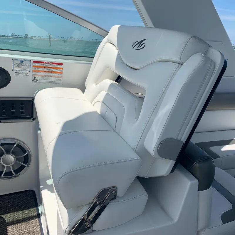 Slide: The Image of White cushioned seat in the cockpit of a 2015 Monterey 275 Sport Yacht. - 4