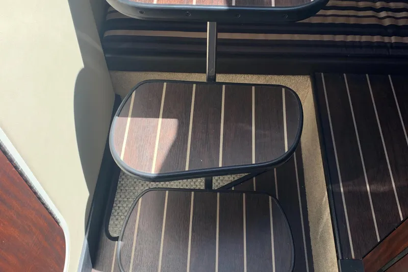 Slide: The Image of Staircase in a yacht cabin with wood finish and striped carpet. - 18