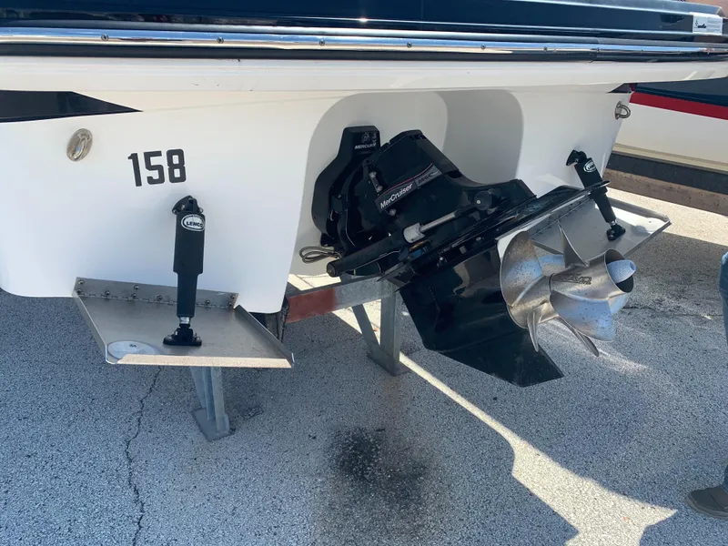 Slide: The Image of The image shows the stern of a 2015 Monterey 275 Sport Yacht with an outboard motor. - 21