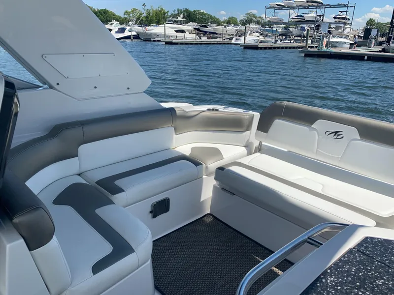 Slide: The Image of The image shows the cockpit of a 2015 Monterey 275 Sport Yacht with white and gray seating. - 27