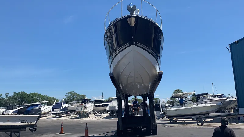 Slide: The Image of A 2015 Monterey 275 Sport Yacht is being transported on land on a trailer. - 22