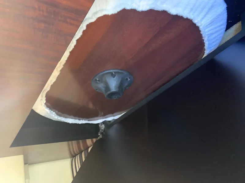 Slide: The Image of Close-up of a round wooden table with a metal base in a yacht cabin. - 37