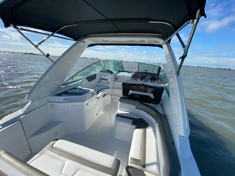 Slide: The Image of 2015 Monterey 275 Sport Yacht on the water with spacious cockpit and comfortable seating. - 2