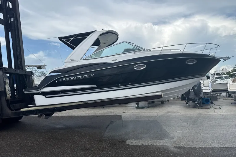 The Image of 2015 Monterey 275 Sport Yacht on forklift, showcasing sleek design and modern features. - 0