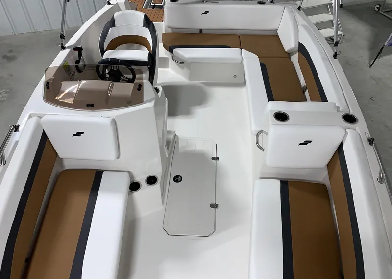 Slide: The Image of 2024 Starcraft SVX 171 boat interior with white and brown seating. - 16