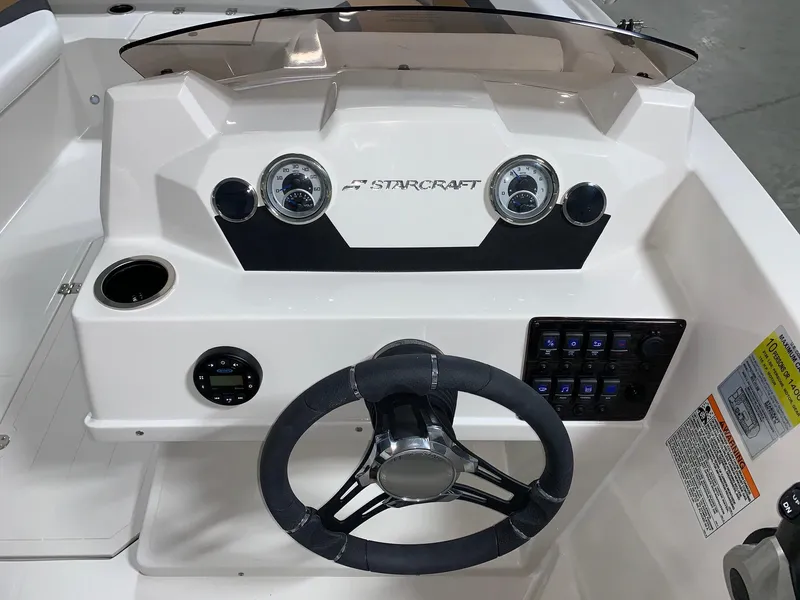 Slide: The Image of 2024 Starcraft SVX 171 boat dashboard with steering wheel and control panel. - 4