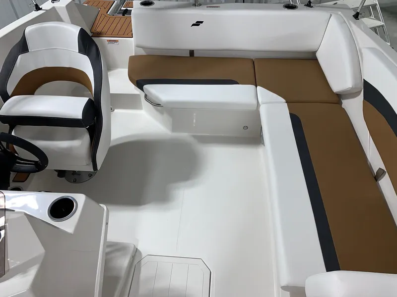 Slide: The Image of 2024 Starcraft SVX 171 boat interior with white and brown seating. - 8