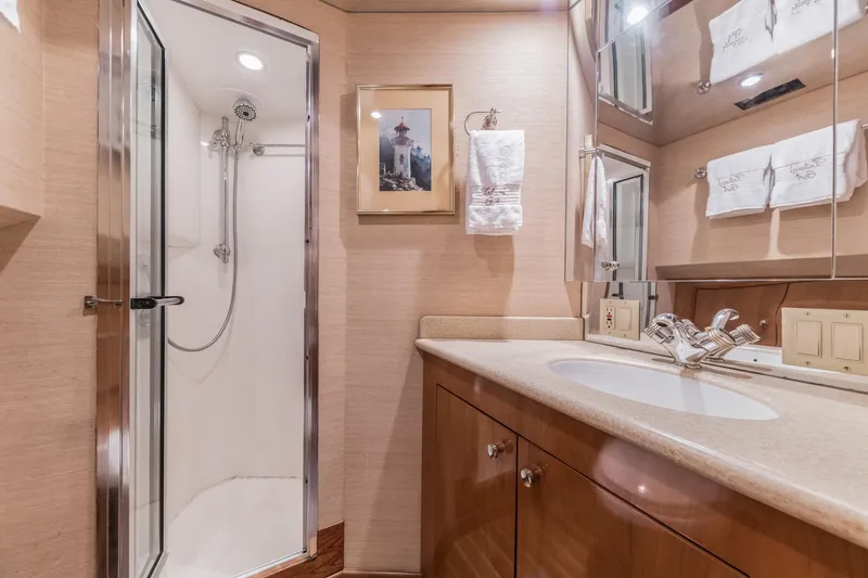 Slide: The Image of Luxurious bathroom in a 2002 Hatteras Motor Yacht with shower and elegant fixtures. - 36