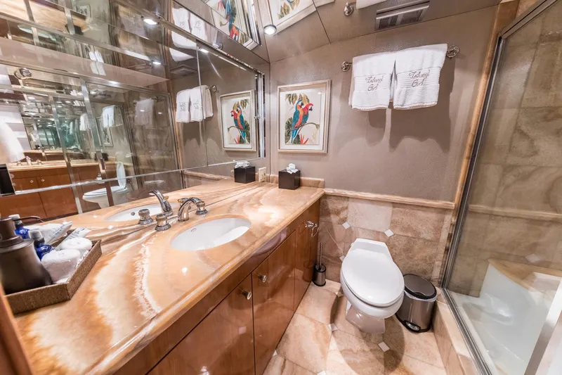 Slide: The Image of Luxurious bathroom in a 2002 Hatteras Motor Yacht with elegant fixtures and decor. - 38