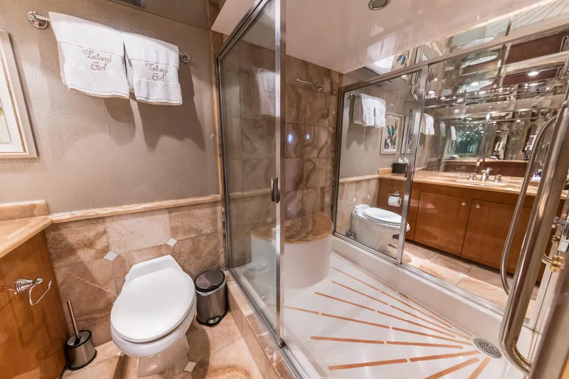 Slide: The Image of Luxurious bathroom in a 2002 Hatteras Motor Yacht with glass shower and elegant fixtures. - 39