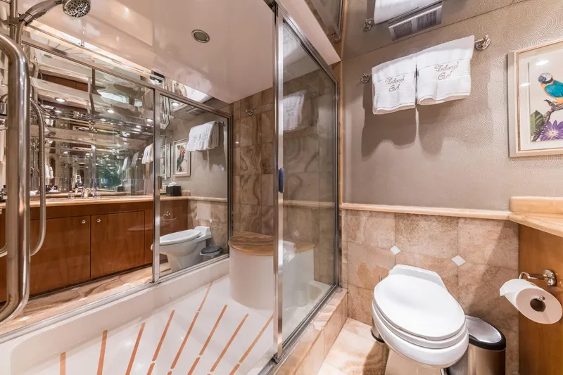 Slide: The Image of Luxurious bathroom in a 2002 Hatteras Motor Yacht with elegant fixtures and decor. - 40