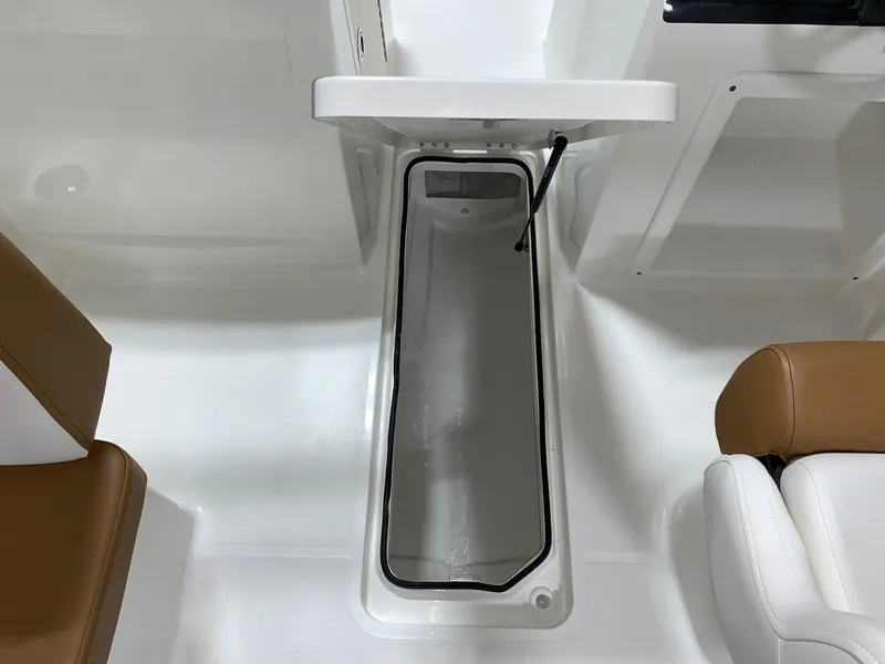 Slide: The Image of 2024 Bayliner VR4 boat interior storage compartment with open lid. - 15