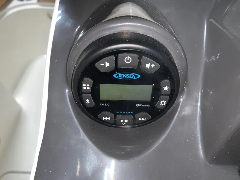 Slide: The Image of 2024 Bayliner VR4 boat stereo system with Jensen Bluetooth controls. - 11