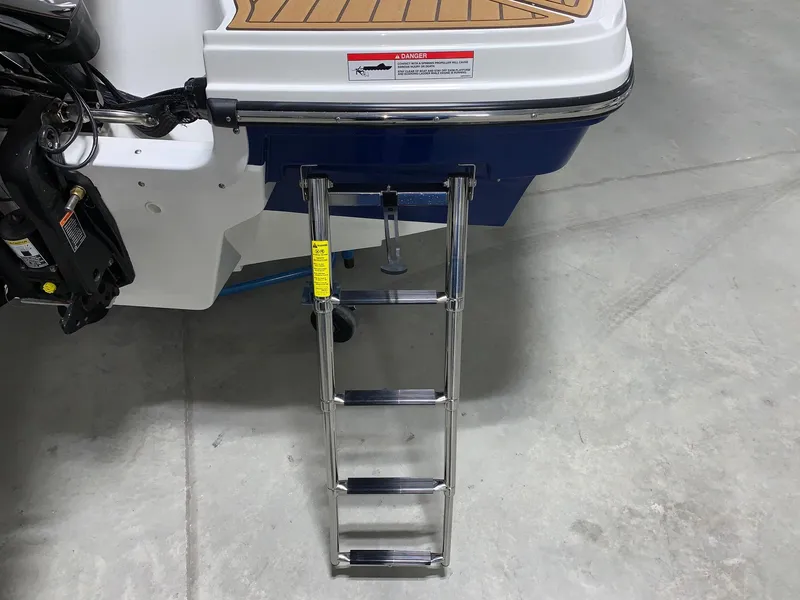 Slide: The Image of 2024 Bayliner VR4 boat with extended swim platform and ladder. - 3