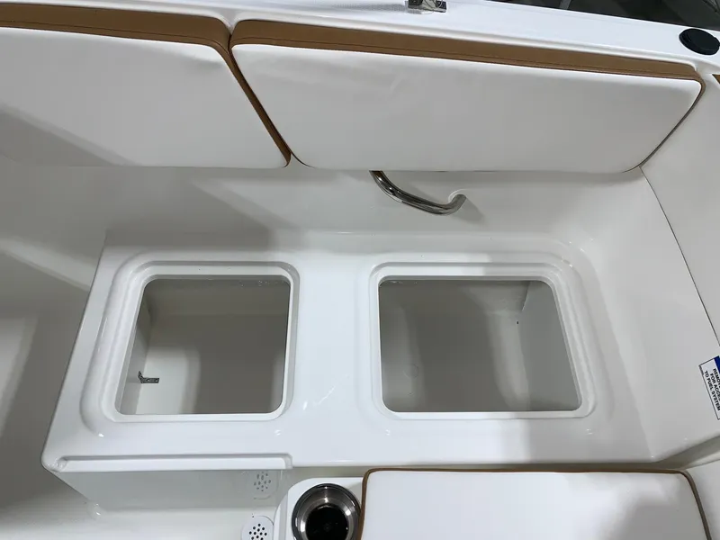 Slide: The Image of 2024 Bayliner VR4 boat interior storage compartments and seating. - 8