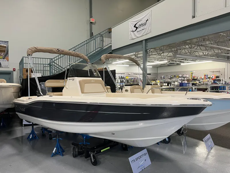 The Image of 2024 Scout 175 Sportfish boat displayed in showroom, featuring sleek design and modern amenities. - 0