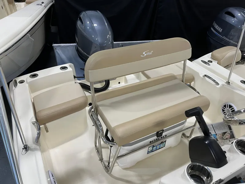 Slide: The Image of 2024 Scout 175 Sportfish boat interior with seating and motor. - 3